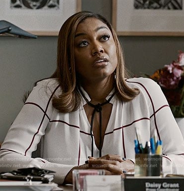 Daisy's white checked tie-neck blouse on Madam Secretary