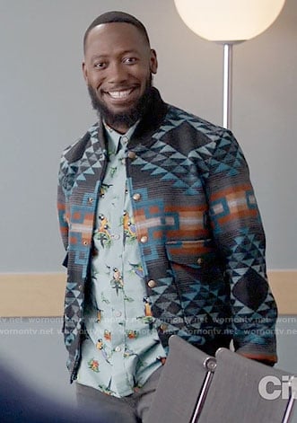 Winston's blue parrot print shirt and patterned bomber jacket on New Girl