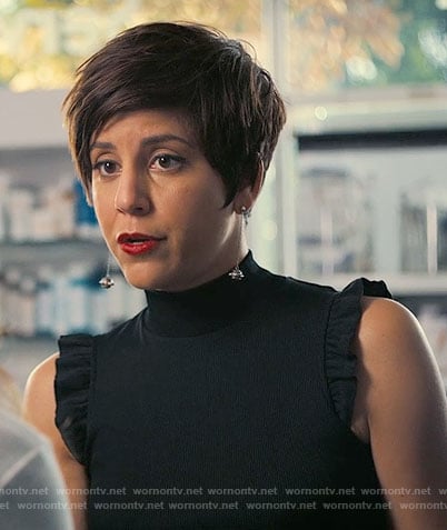 Annie's black ruffled sleeve top on Girlboss