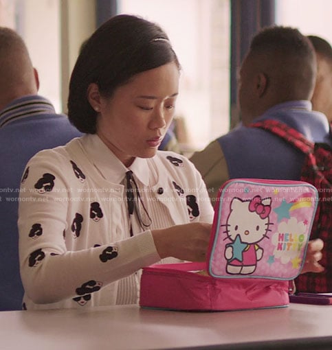 Courtney's white face print cardigan and Hello Kitty lunchbox on 13 Reasons Why