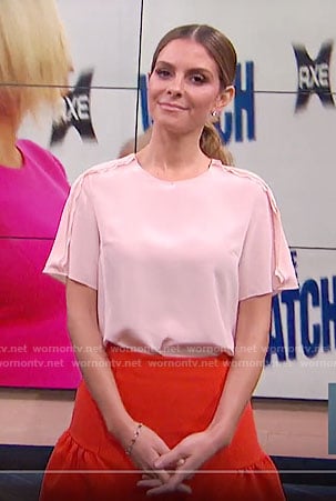 Maria's pink top and red drop waist skirt on E! News