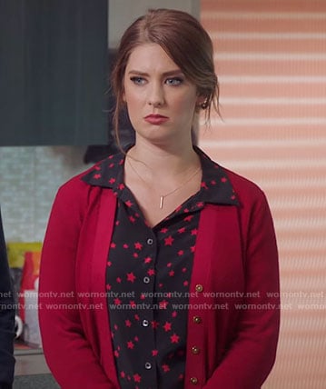 Katie's black star print shirt on Great News