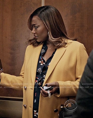 Daisy's medal print dress and yellow coat on Madam Secretary