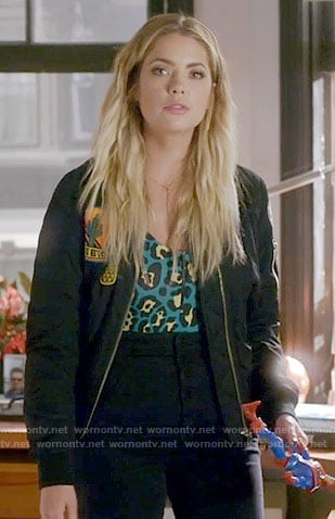 Hanna's green leopard print top and patched bomber jacket on Pretty Little Liars