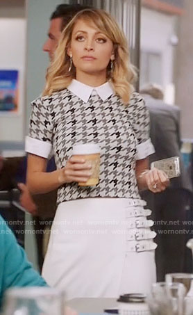 Portia's grey houndstooth top and white buckled skirt on Great News