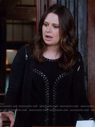 Quinn's black eyelet top and zip-shoulder cardigan on Scandal