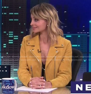 Portia's yellow moto jacket on Great News