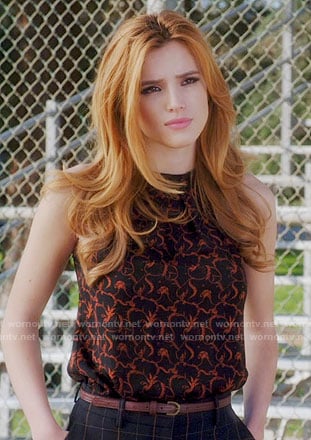 Paige's black and orange printed top on Famous in Love