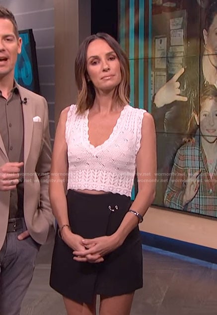 Catt's black wrap mini skirt on E! News