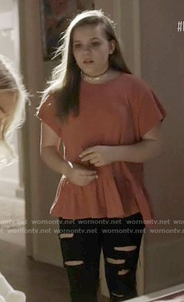 Daphne's coral peplum tee on Nashville