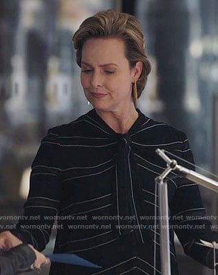 Jacqueline's black striped tie-neck top on The Bold Type
