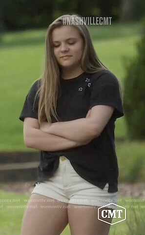 Daphne's black t-shirt with white stars on Nashville