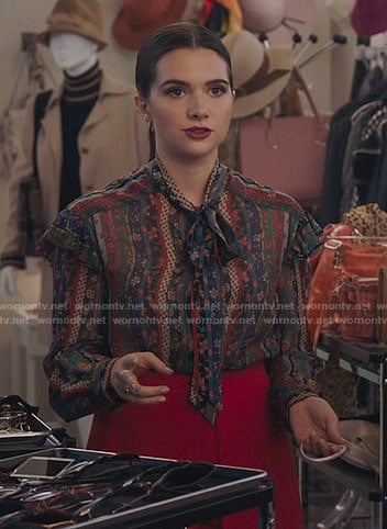 Jane's floral tie neck blouse and red shorts on The Bold Type