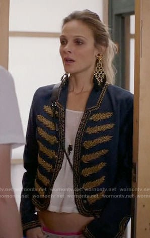 Phoebe's blue jacket with gold embroidery and black tassel earrings on Girlfriends Guide to Divorce