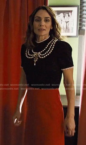 Sam's black and red dress with pearls on Friends from College