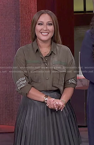 Adrienne's khaki shirt and black pleated skirt on The Real