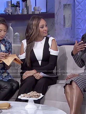 Tamera's white and black cold-shoulder jumpsuit on The Real