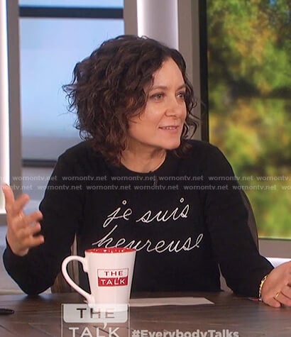 Sara's black je suis heureuse sweater on The Talk