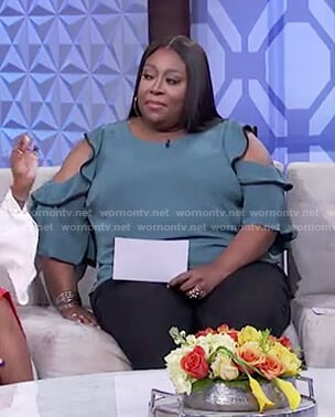 Loni's green cold shoulder black trim top on The Real