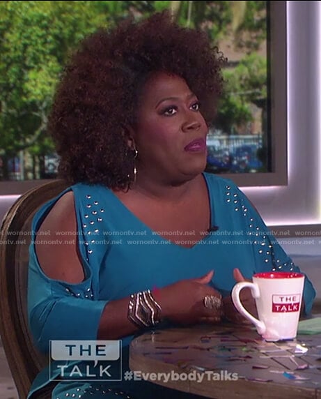 Sheryl's teal cold shoulder studded top on The Talk