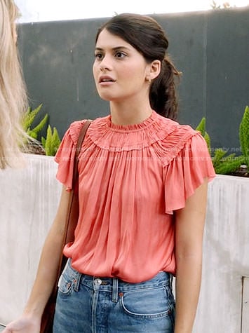 Sabrina's coral ruffled top on The Mick