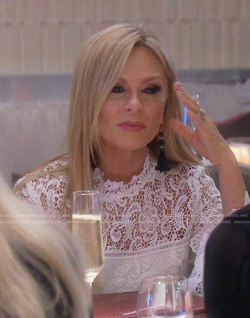 Tamra's white lace bell sleeved top on The Real Housewives of OC
