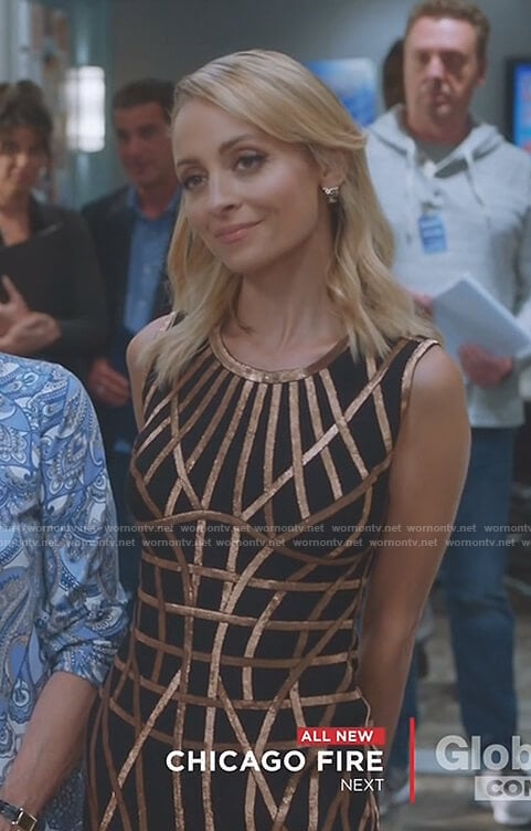 Portia's black and gold sleeveless cage dress on Great News