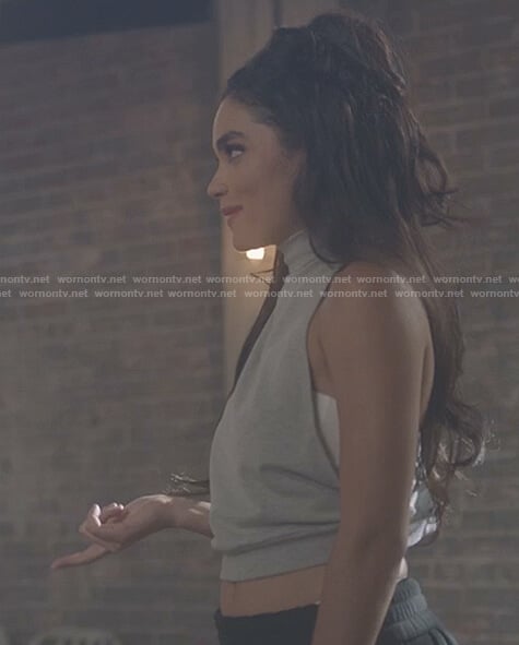 Simone's grey knotted back mock neck top on Star