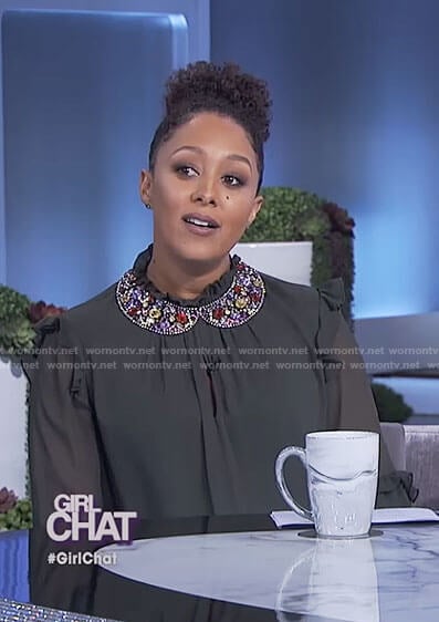 Tamera's dark green ruffle mock neck top and beaded collar necklace on The Real