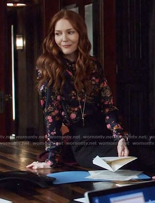 Abby's black floral blouse on Scandal