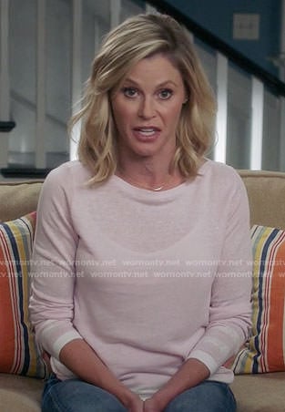 Claire's pink sweater with striped trim on Modern Family
