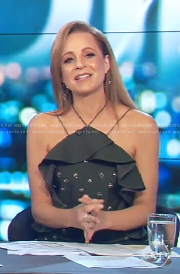 Carrie's green off shoulder studded ruffle dress on The Project