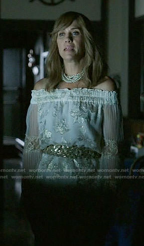 Pamela's white and gold off-shoulder top on Last Man on Earth