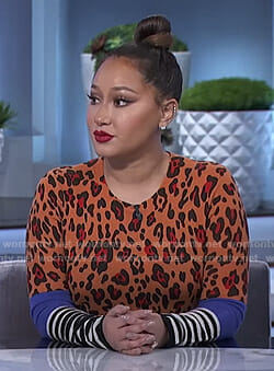 Adrienne's orange leopard sweater on The Real