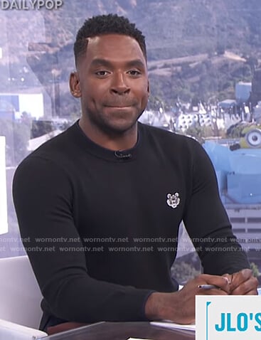 Justin's black tiger patch sweater on E! News Daily Pop