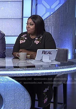 Loni's black floral embroidered jumpsuit on The Real
