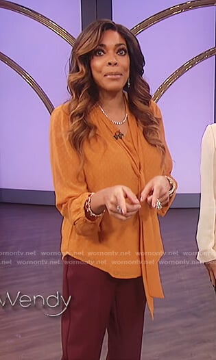Wendy's orange bow neck top on The Wendy Williams Show