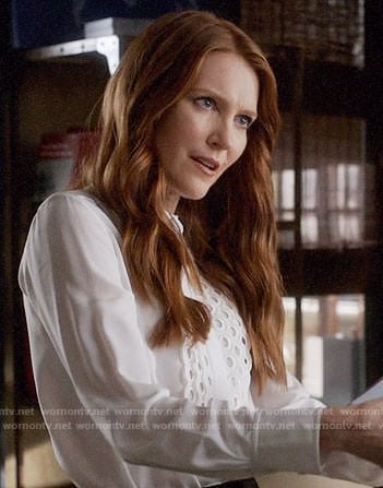 Abby's white scalloped eyelet trim top on Scandal