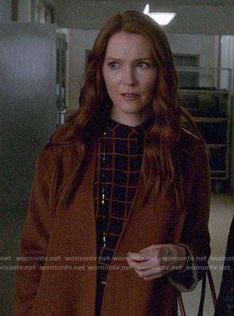 Abby's checked top on Scandal