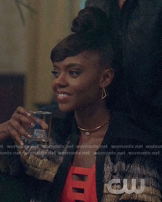 Josie's orange cutout dress and fringed jacket on Riverdale