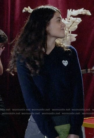 Sabrina's navy sweater with white heart patch on The Mick