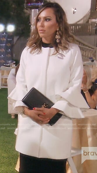 Kelly's white bell sleeve coat on The Real Housewives of OC