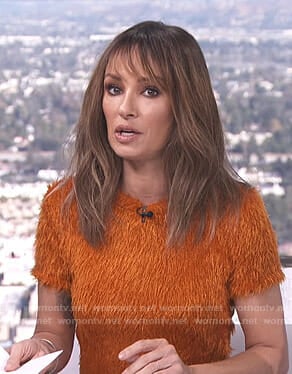 Catt's orange fluffy short sleeve top on E! News Daily Top