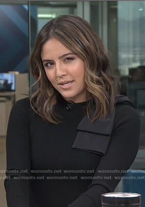 Erin's black big bow shoulder top on Live from E!