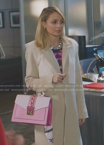 Portia's beige fur panel coat and pink hand bag on Great News