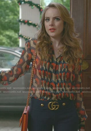 Fallon's printed blouse and blue cropped pants on Dynasty