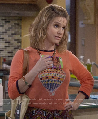 Kimmy's orange hot air balloon sweater on Fuller House