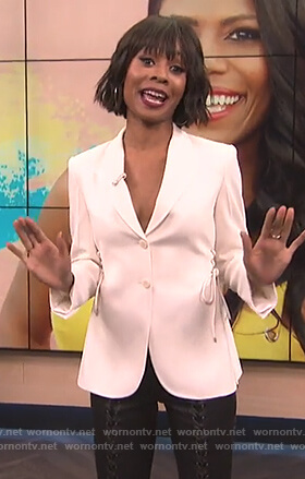 Zuri's white lace-up blazer and leather pants on E! News