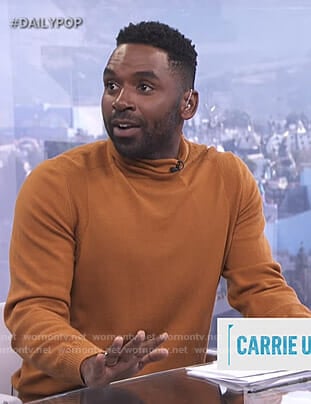 Justin's orange turtleneck sweater on E! News Daily Pop