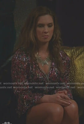 Katie's black floral pleated blouse on Great News